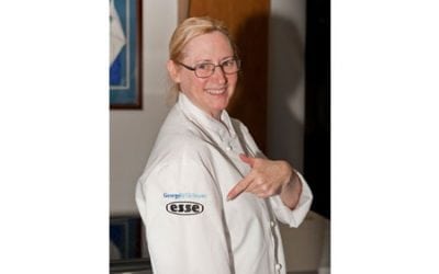 claire-clark-pointing-at-esse-logo