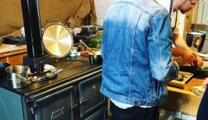 preparing food next to an ESSE range cooker