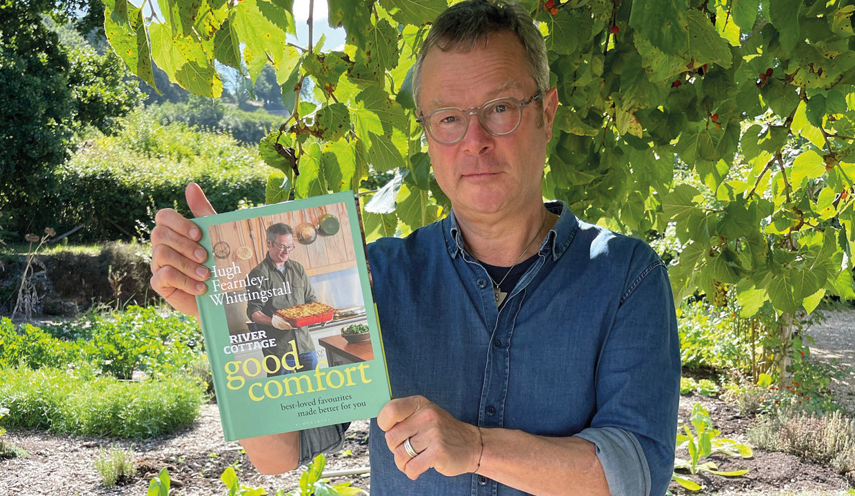 Hugh Fearnley Whittingstall holding River Cottage Good Comfort Best Loved Favourites Made Better for You book
