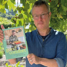 Hugh Fearnley Whittingstall holding River Cottage Good Comfort Best Loved Favourites Made Better for You book